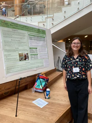 Emily Hung presents her poster at the symposium